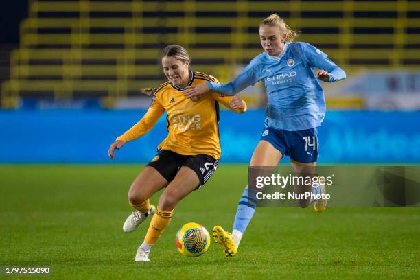 Courtney Nevin of Leicester City W.F.C. Is being tackled by Esme Morgan of Manchester City during the FA Women's Continental League Cup Group B match...