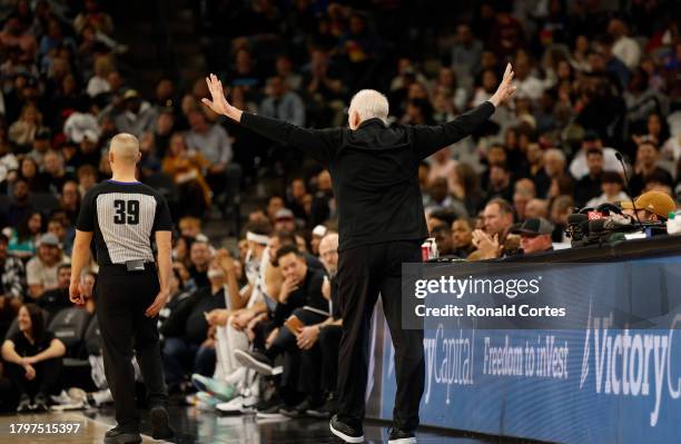 Gregg Popovich head coach of the San Antonio Spurs tries to quiet down the booing at the official in a game against the Los Angeles Clippers in the...