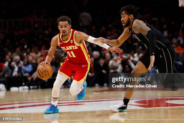 Trae Young of the Atlanta Hawks drives to the basket during the game against the Brooklyn Nets on NOVEMBER 22, 2023 at State Farm Arena in Atlanta,...