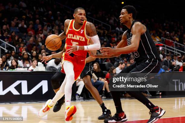 Dejounte Murray of the Atlanta Hawks drives to the basket during the game against the Brooklyn Nets on NOVEMBER 22, 2023 at State Farm Arena in...