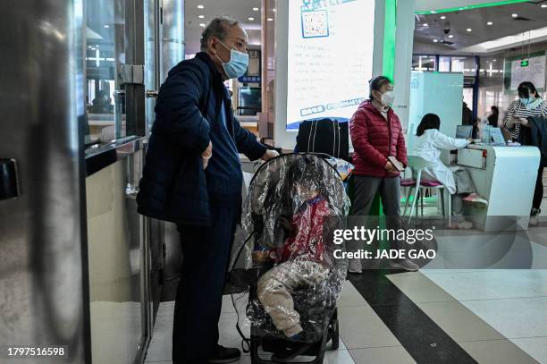 Children and their parents wait at an outpatient area at a children hospital in Beijing on November 23, 2023. The World Health Organization has asked...