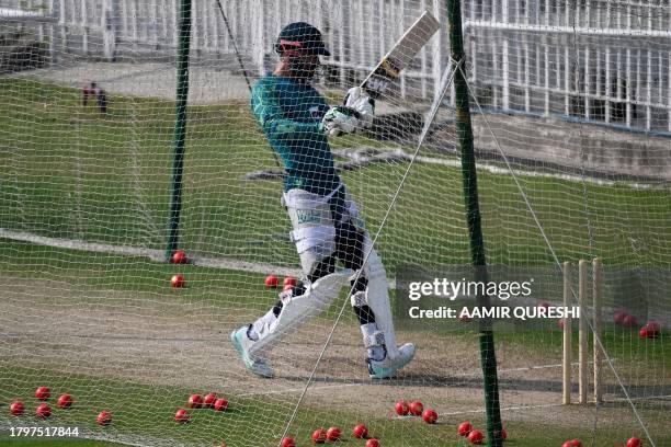 Pakistan's captain Shan Masood bats in the nets during a practice session, ahead of their Australia tour to play three Test match series at the...