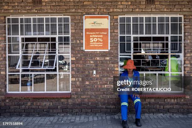 Qualifying electrician sits outside the classroom at Nkangala's Top of the World Training Centre in Emalahleni on November 22, 2023. The centre...