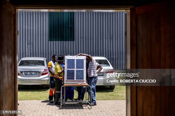 Qualifying electricians tests how a solar panel works during the practical part of the training at Nkangala's Top of the World Training Centre in...