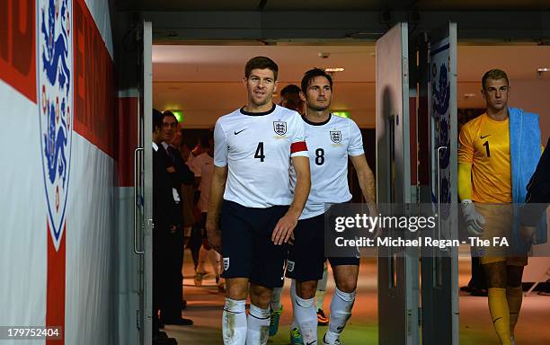Steven Gerrard and Frank Lampard walk out for the 2nd half during the FIFA 2014 World Cup Qualifying Group H match between England and Moldova at...