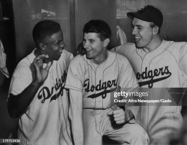 Three of the guns in the lone Dodgers victory over the Yankees in the World Series were, left to right, American former baseball player Jackie...