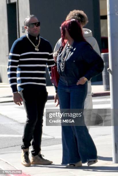 Garcelle Beauvais, Jax Joseph Nilon, and Oliver Saunders are seen leaving lunch on November 21, 2023 in Los Angeles, California.