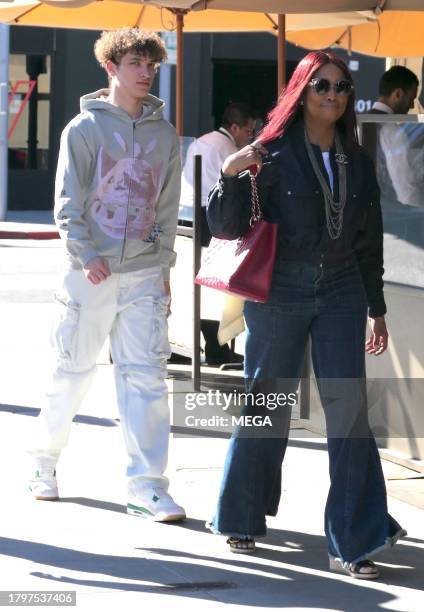 Garcelle Beauvais, Jax Joseph Nilon, and Oliver Saunders are seen leaving lunch on November 21, 2023 in Los Angeles, California.