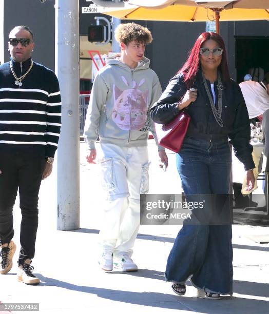 Garcelle Beauvais, Jax Joseph Nilon, and Oliver Saunders are seen leaving lunch on November 21, 2023 in Los Angeles, California.