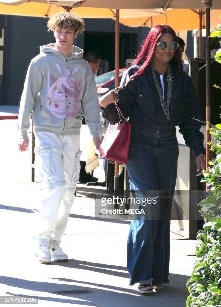 Garcelle Beauvais, Jax Joseph Nilon, and Oliver Saunders are seen leaving lunch on November 21, 2023 in Los Angeles, California.