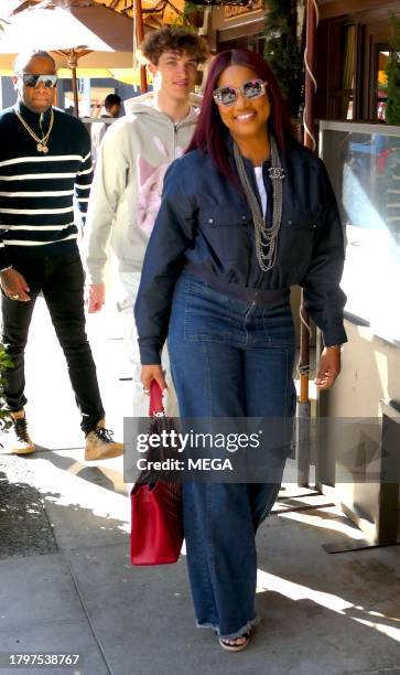 Garcelle Beauvais, Jax Joseph Nilon, and Oliver Saunders are seen leaving lunch on November 21, 2023 in Los Angeles, California.