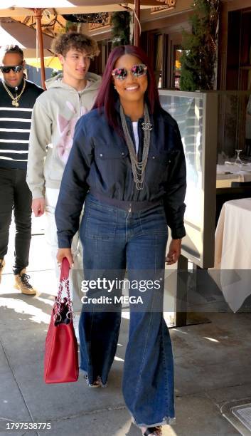 Garcelle Beauvais, Jax Joseph Nilon, and Oliver Saunders are seen leaving lunch on November 21, 2023 in Los Angeles, California.