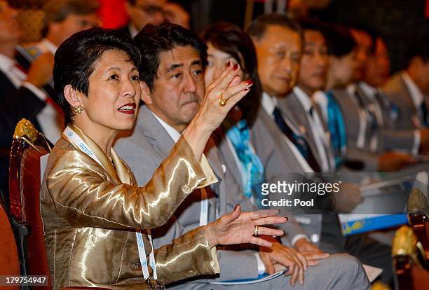Japanese Princess Takamado gestures next to Japanese Prime Minister Shinzo Abe prior to the opening ceremony of the 125th session of the...