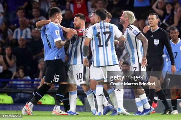 Mathias Olivera of Uruguay argues with Lionel Messi of Argentina during a FIFA World Cup 2026 Qualifier match between Argentina and Uruguay at...