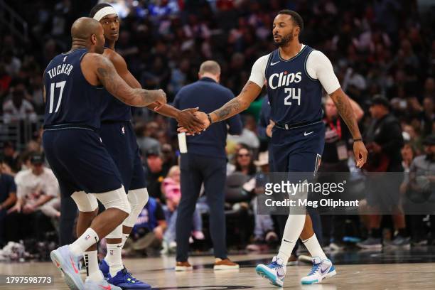 Norman Powell reacts with P.J. Tucker of the LA Clippers in the second half against the Memphis Grizzlies at Crypto.com Arena on November 12, 2023 in...
