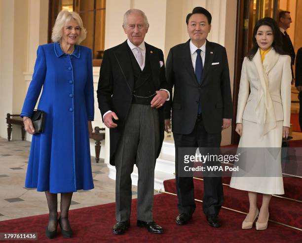 King Charles III and Queen Camilla pose with South Korea's President Yoon Suk Yeol and South Korea's First lady Kim Keon Hee during a formal farewell...