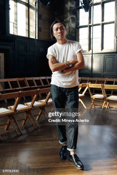 Daisuke Obana poses at N. Hoolywood backstage during Mercedes-Benz Fashion Week Spring 2014 at The Highline Hotel on September 6, 2013 in New York...