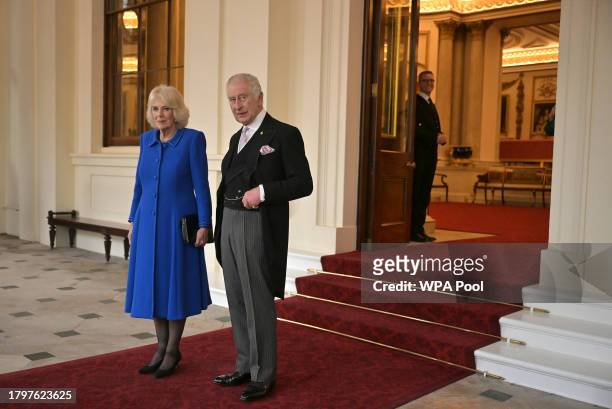 King Charles III and Queen Camilla look towards the media during a formal farewell to South Korea's President Yoon Suk Yeol and South Korea's First...