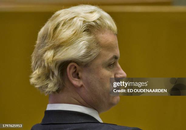 Leader of the far-right parliamentary party Partij voor de Vrijheid, PVV , Dutch Geert Wilders smiles looks on during a parliamentary debate about...