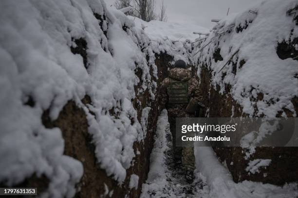 Ukrainian soldier is seen in a trench on the front line in the direction of Kupiansk, where clashes with the Russian army continue despite the severe...