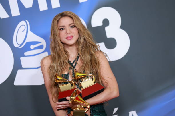 Shakira poses with the awards for Best Song of the Year and Best Pop Song in the media center for The 24th Annual Latin Grammy Awards at FIBES...