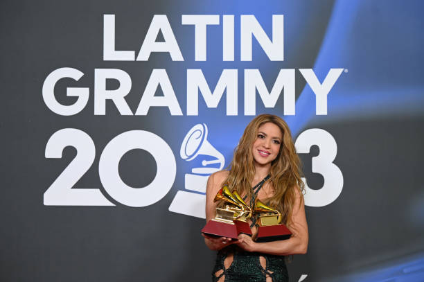 Shakira poses with the awards for Song of the year, Best pop song and Best urban/fusion performance attends The 24th Annual Latin Grammy Awards on...