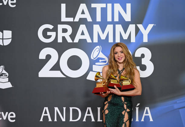 Shakira poses with the awards for Song of the year, Best pop song and Best urban/fusion performance attends The 24th Annual Latin Grammy Awards on...