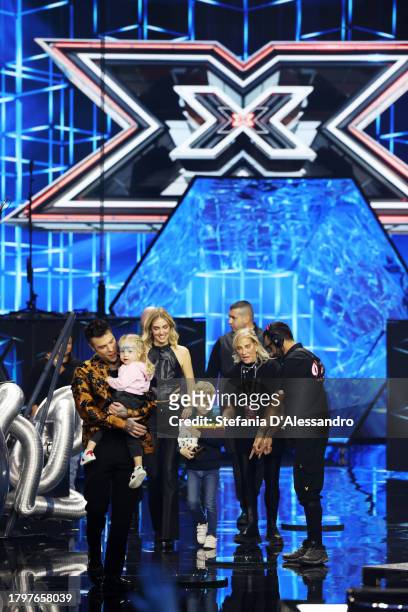 Chiara Ferragni, Fedez along with their daughter Victoria and their son Leone attend the X Factor live tv show on November 16, 2023 in Milan, Italy.