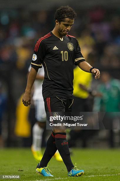 Giovani Dos Santos reacts after losing against Honduras during a match between Mexico and Honduras as part of the 15th round of the South American...