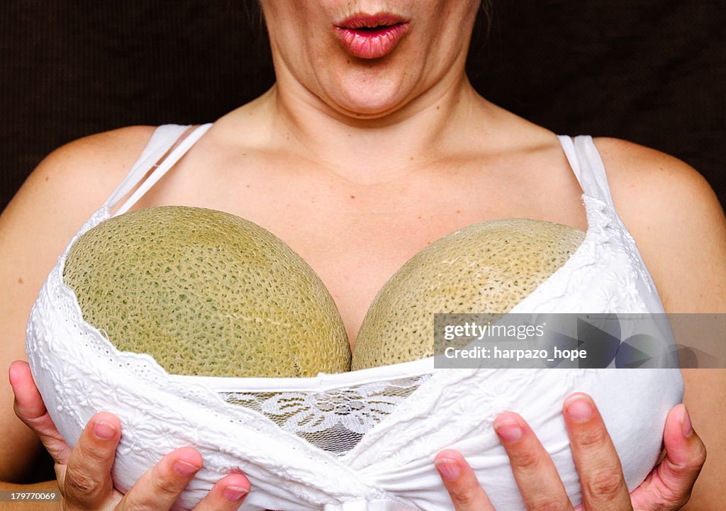 Woman holding melons