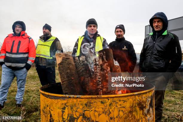 Polish farmers stand on a strike post by the road as they start to block truck transport in Medyka - another border crossing between Poland and...