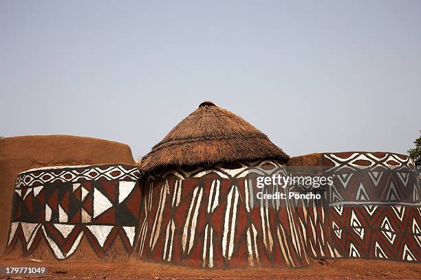 traditionally painted mud huts - thatched roof huts stock pictures, royalty-free photos & images