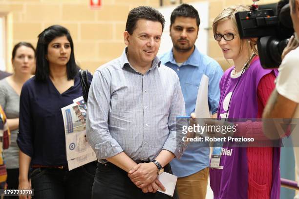 Nick Xenophon Independent senator for SA waits in line to cast his vote in the electorate of Sturt on election day on September 7, 2013 in Adelaide,...