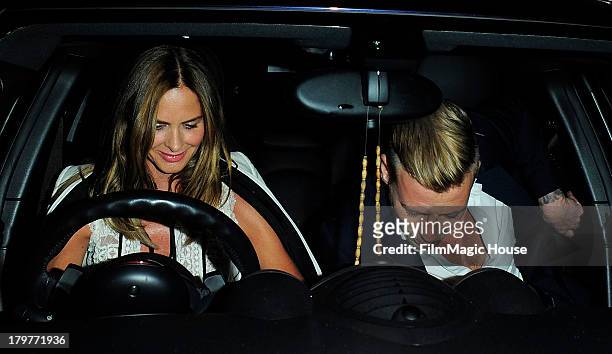 Trinny Woodall leaves Lulu Private Member's Club with a mystery younger man. On September 6, 2013 in London, England.