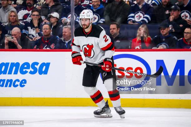 Brendan Smith of the New Jersey Devils keeps an eye on the play during first period action against the Winnipeg Jets at the Canada Life Centre on...