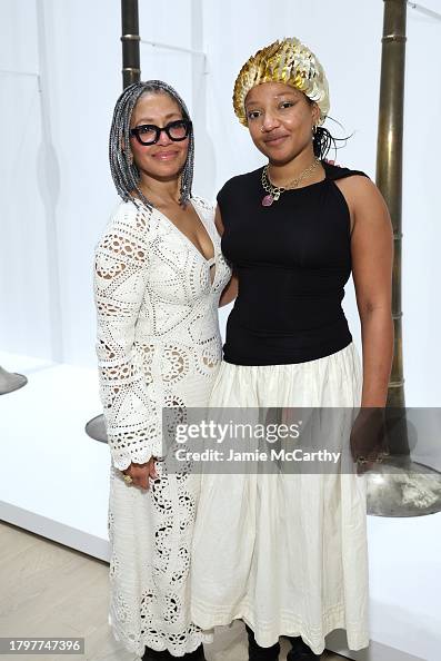 Merele Williams-Adkins andTuriya Adkins attend the opening reception
