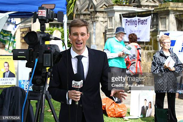 Sky News reporter performs a live cross from the Cottesloe Civic Centre in the electorate of Curtin on election day on September 7, 2013 in Perth,...