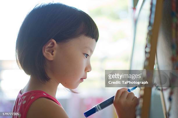 girl drawing picture - draw attention stock pictures, royalty-free photos & images