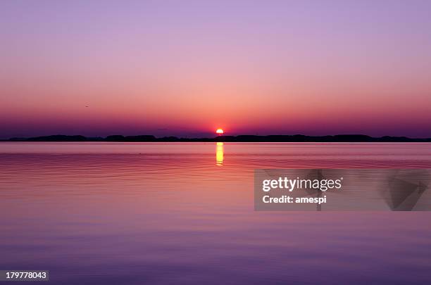 the last sunset - sunset sea stock pictures, royalty-free photos & images