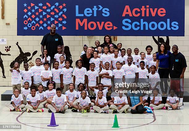 Shaquille O'Neal, U.S. First Lady Michelle Obama, Allyson Felix and Dominique Dawes visit Orr Elementary in Washington, DC for a back to school event...