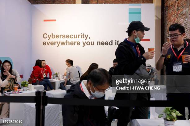 People attend the Fortinet Informational Security Carnival at Huashan Creative Park in Taipei on November 23, 2023.
