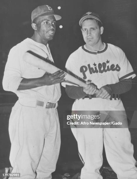 American baseball player Jackie Robinson of the Brooklyn Dodgers with Phillies manager Ben Chapman in an uncomfortable meeting during the 1947...