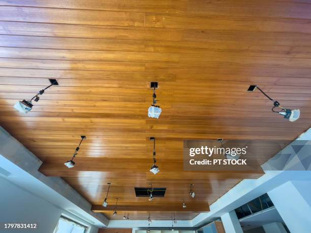 the unfinished house structure has unfinished wooden furniture and lamps. - unfinished basement stock pictures, royalty-free photos & images
