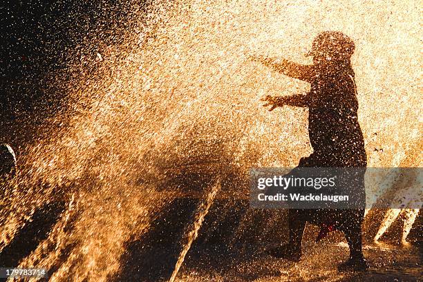 water fun - girl wet casual clothing stock pictures, royalty-free photos & images