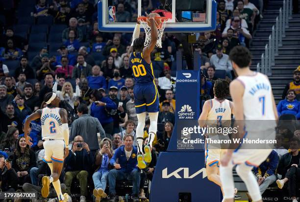 Jonathan Kuminga of the Golden State Warriors slam dunks against the Oklahoma City Thunder during the first quarter at Chase Center on November 16,...