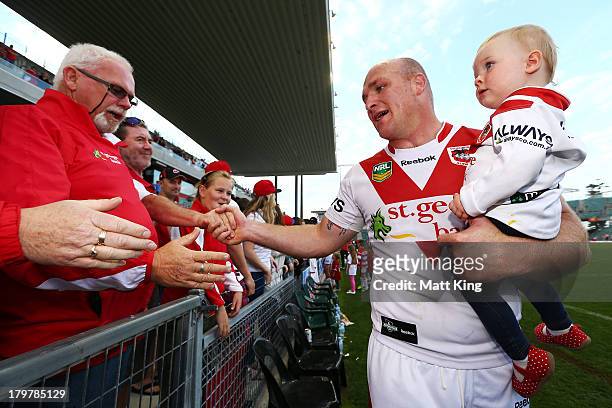 Michael Weyman of the Dragons farewells fans after playing his last game for the club after the round 26 NRL match between the St George Illawarra...