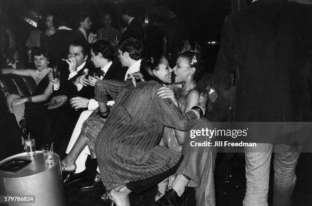 Spanish fashion designer Paloma Picasso and German fashion designer Karl Lagerfeld enjoy a night out at Studio 54, New York City, 1979.