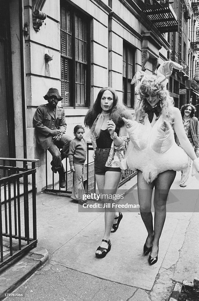 Two men in fancy dress walk on a street in Greenwich Village, New ...