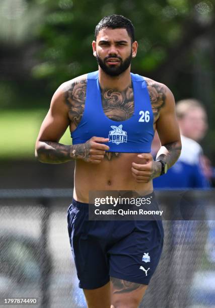 Tarryn Thomas of the Kangaroos runs laps during a North Melbourne Kangaroos AFL training session at Arden Street Ground on November 17, 2023 in...