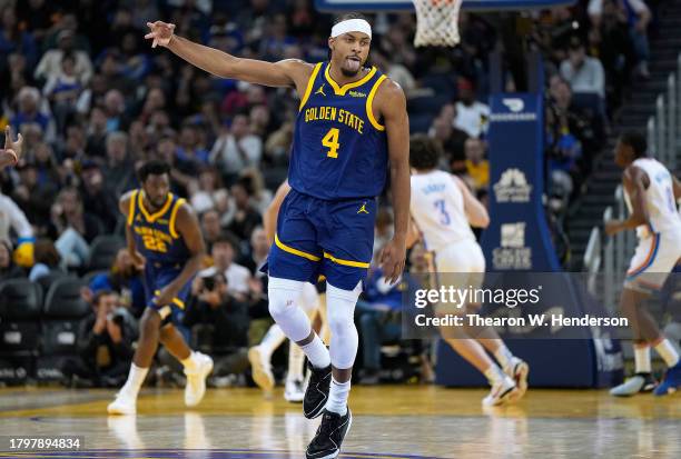 Moses Moody of the Golden State Warriors celebrates after making a three-point shot against the Oklahoma City Thunder during the first quarter at...